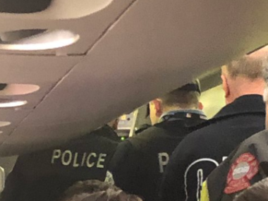 police on airline cabin